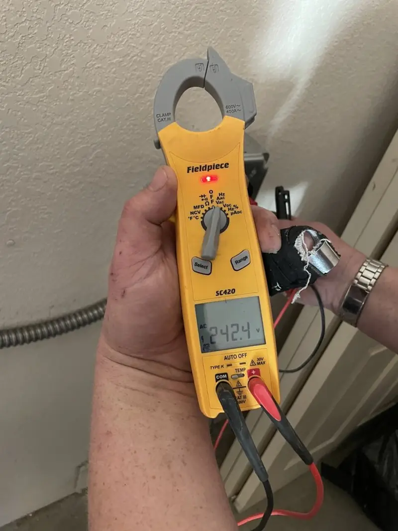 Voltage testing with clamp meter during Generator Installation in Summit